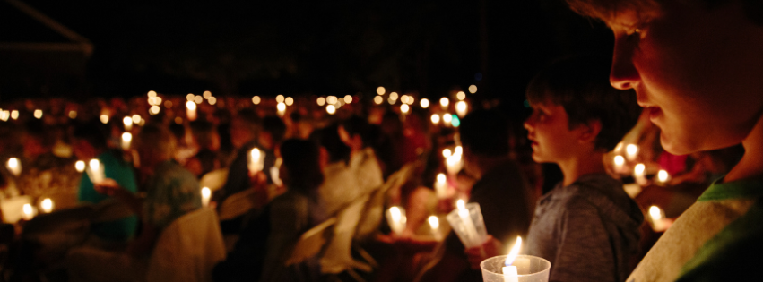 Candles and flowers at a remembrance site